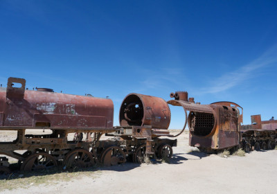 On the outskirts of the desert town of Uyuni, high on the Andean plain, steel giants have been destroyed by salt winds.